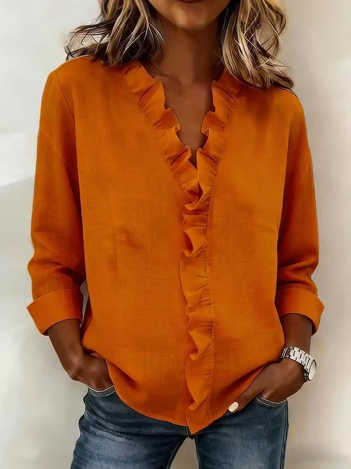 Chiara™ | Blouse with a V-neckline and delicate ruffle details
