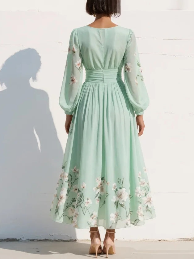 Light green chiffon midi dress with a pleated V-neckline